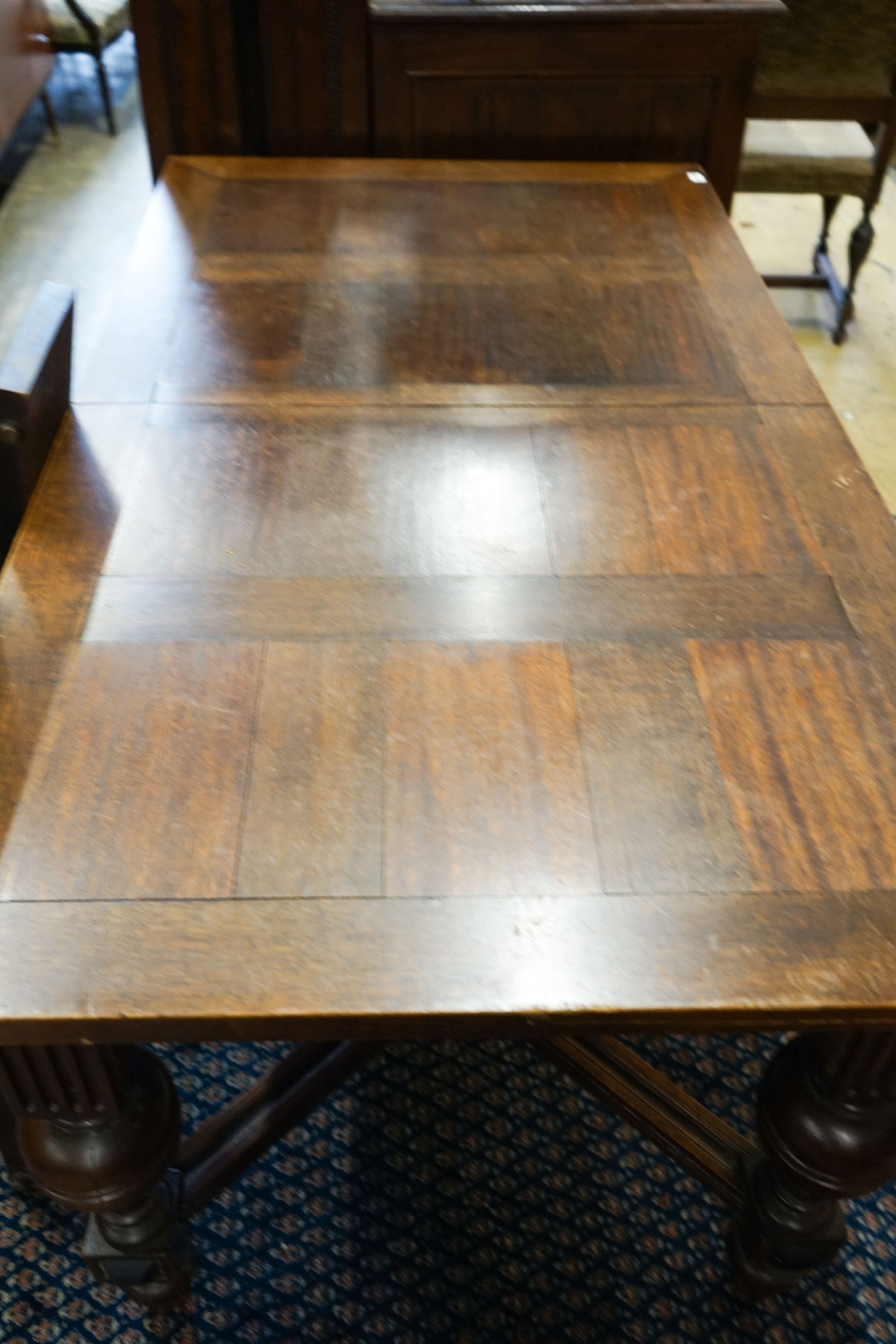 A 19th century Dutch rectangular oak extending dining table, 220cm extended, width 94cm, height 76cm on four carved bulbous supports (two additional leaves) and a set of five dining chairs